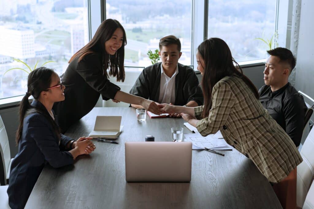 CF Outsourcing Solutions team collaborating in a modern office – professional outsourcing services in the Philippines for U.S. clients in IT, healthcare, and customer support. We are the top outsourcing company in the Philippines.