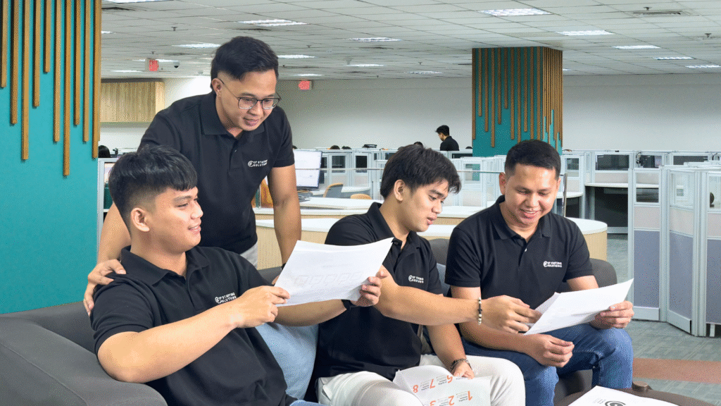 CF Outsourcing Solutions team collaborating in a modern office – professional outsourcing services in the Philippines for U.S. clients in IT, healthcare, and customer support. We are the top outsourcing company in the Philippines.