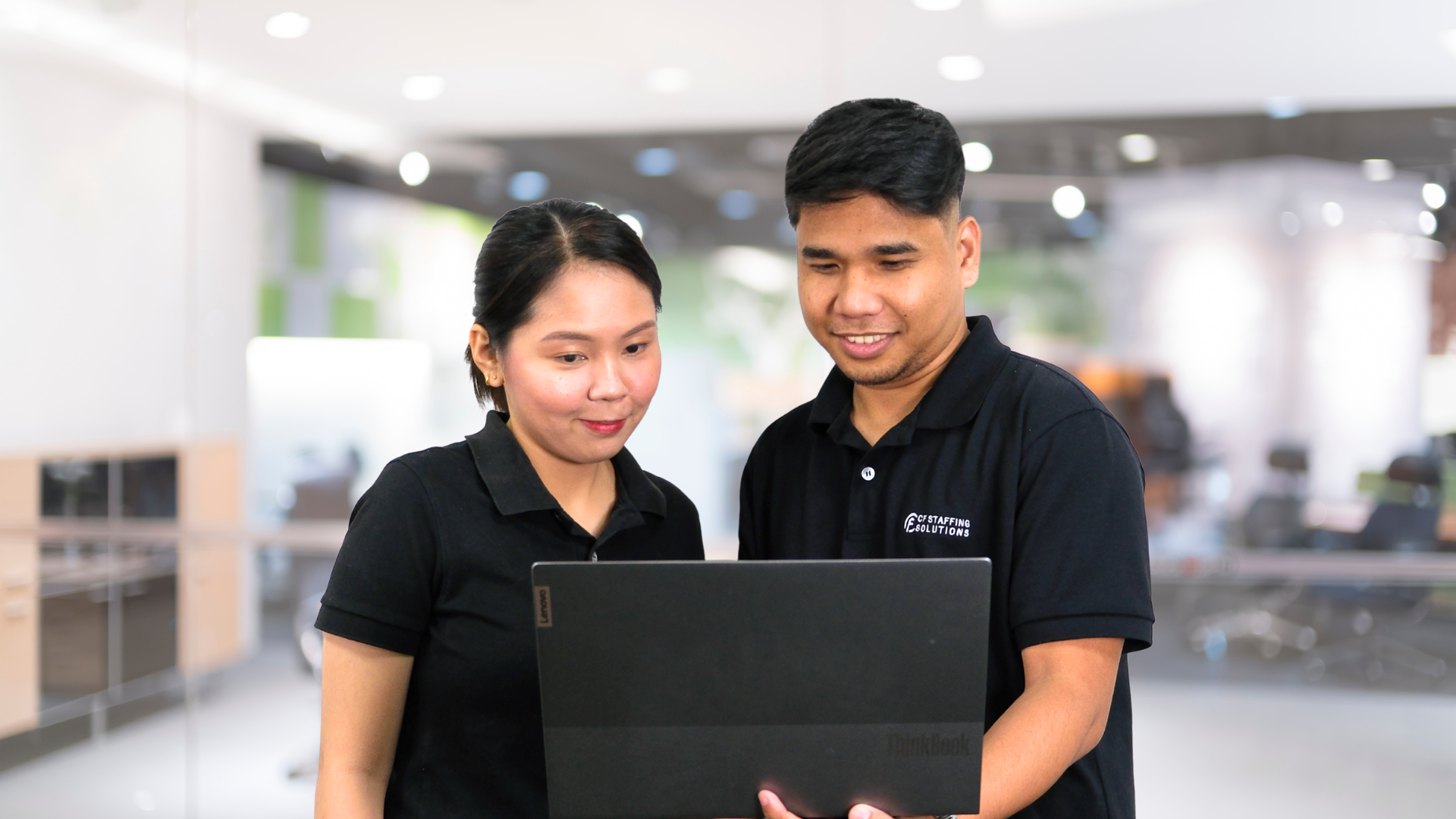 CF Outsourcing Solutions team collaborating in a modern office – professional outsourcing services in the Philippines for U.S. clients in IT, healthcare, and customer support. We are the top outsourcing company in the Philippines.