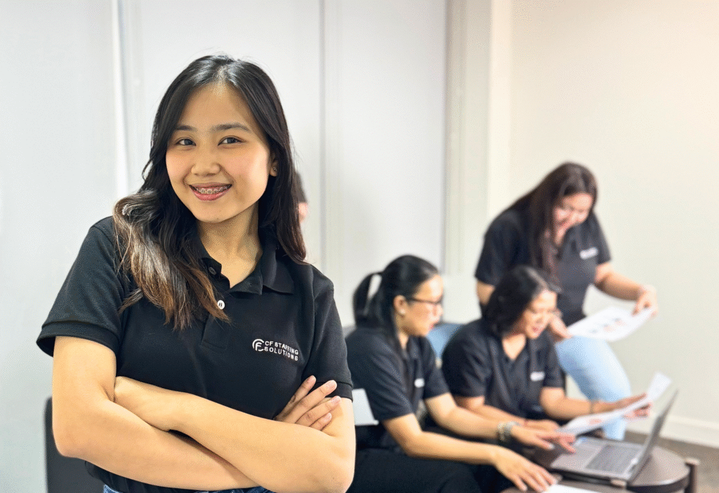 CF Outsourcing Solutions team collaborating in a modern office – professional outsourcing services in the Philippines for U.S. clients in IT, healthcare, and customer support. We are the top outsourcing company in the Philippines.