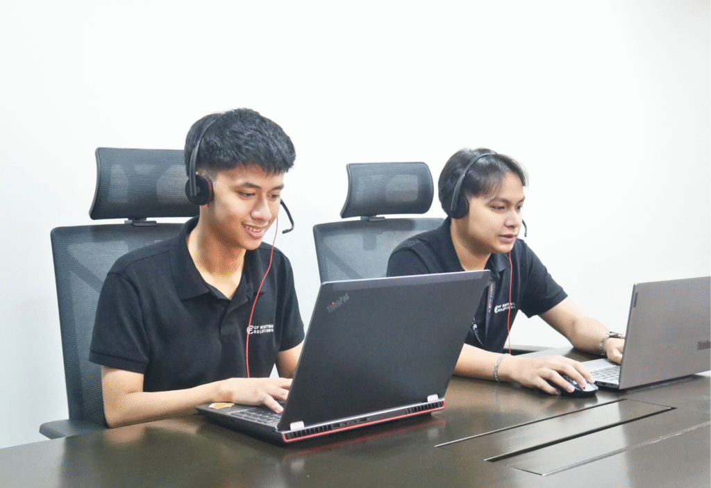 CF Outsourcing Solutions team collaborating in a modern office – professional outsourcing services in the Philippines for U.S. clients in IT, healthcare, and customer support. We are the top outsourcing company in the Philippines.