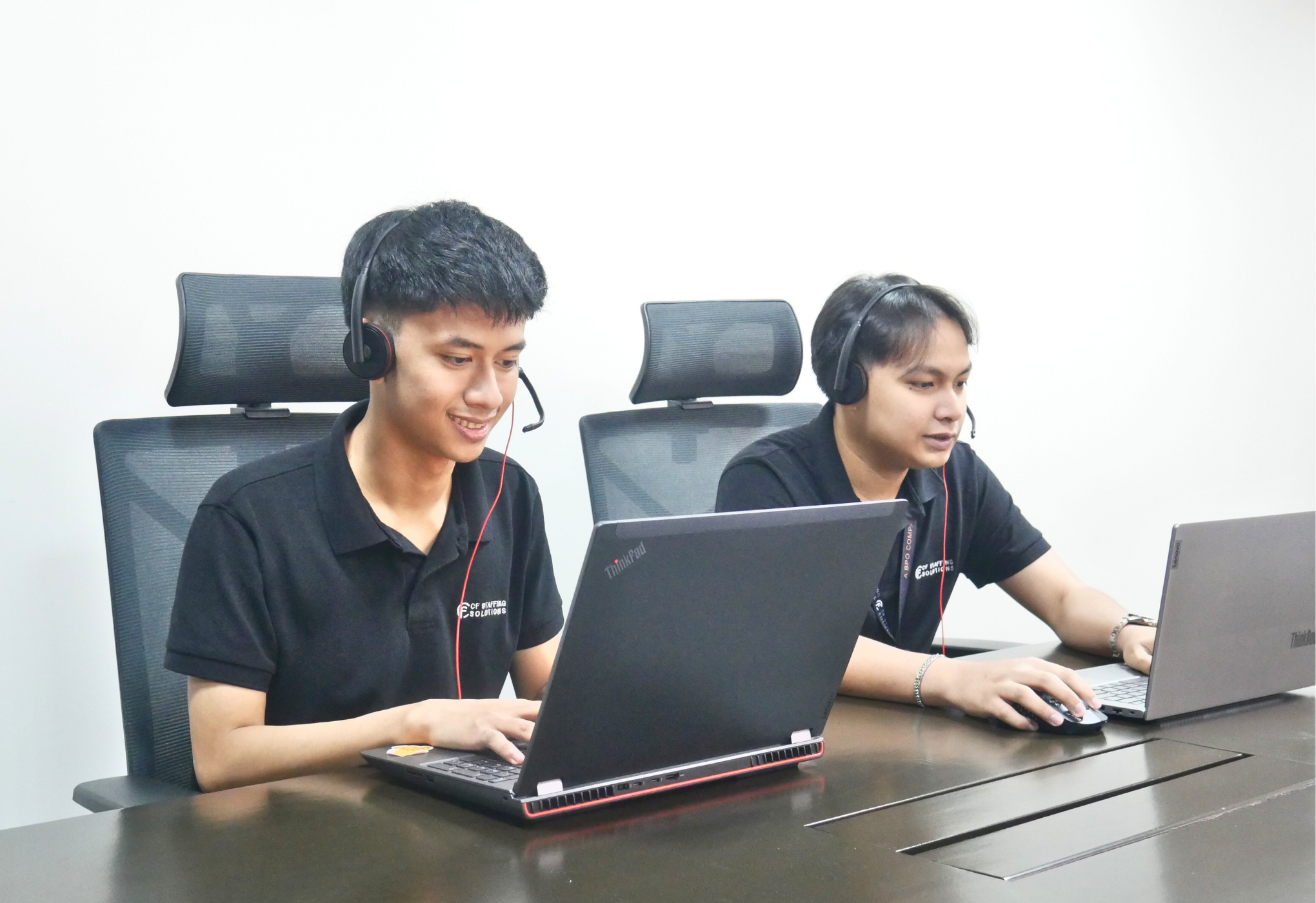 CF Outsourcing Solutions team collaborating in a modern office – professional outsourcing services in the Philippines for U.S. clients in IT, healthcare, and customer support. We are the top outsourcing company in the Philippines.