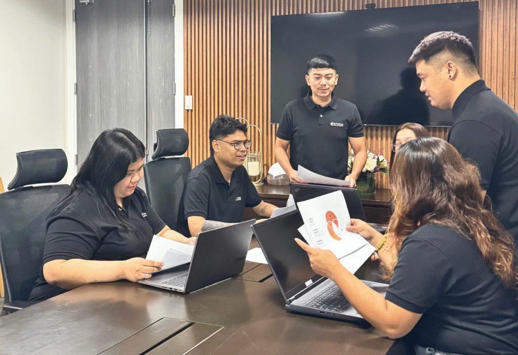 CF Outsourcing Solutions team collaborating in a modern office – professional outsourcing services in the Philippines for U.S. clients in IT, healthcare, and customer support. We are the top outsourcing company in the Philippines.