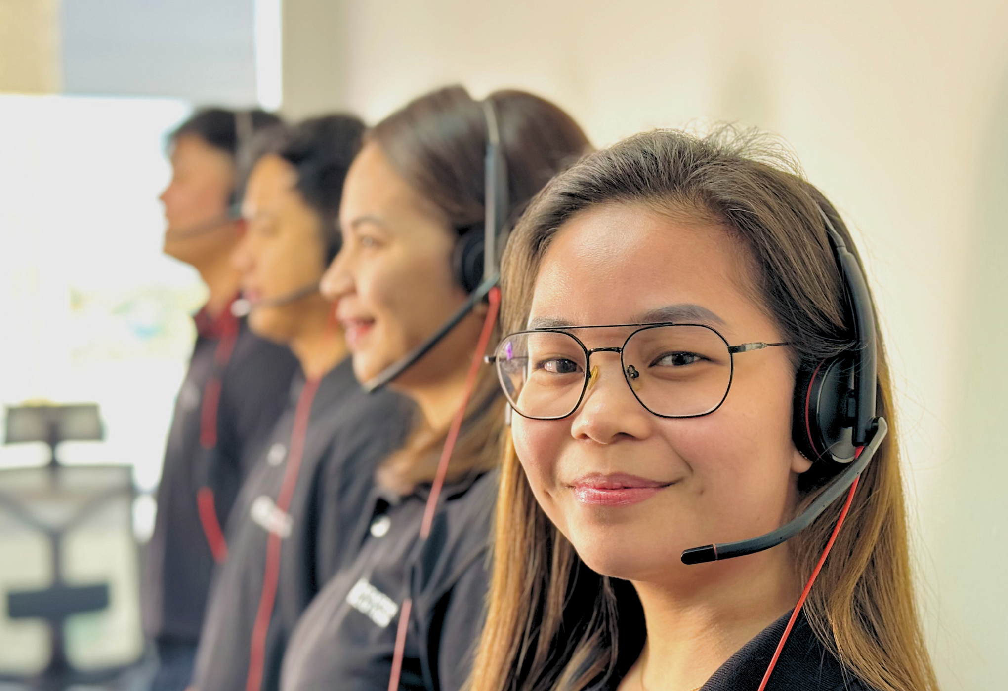 CF Outsourcing Solutions team collaborating in a modern office – professional outsourcing services in the Philippines for U.S. clients in IT, healthcare, and customer support. We are the top outsourcing company in the Philippines.