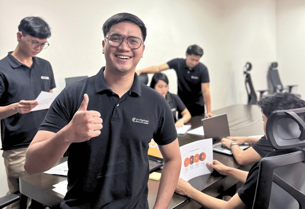 CF Outsourcing Solutions team collaborating in a modern office – professional outsourcing services in the Philippines for U.S. clients in IT, healthcare, and customer support. We are the top outsourcing company in the Philippines.